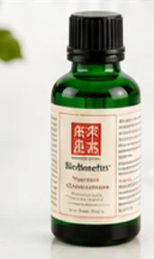 The BioBenefits Signature Concentrate: a small dark green glass bottle with a cream label and a black cap.